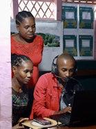 People looking at a computer