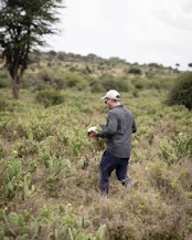 Lorenz Zeller identifying opuntia distribution in the landscape, Laikipia, Kenya