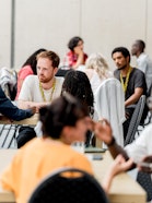 People discussing in various table circles