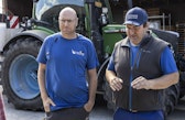 A working conversation on the Schwab family farm in Grosses Moos—Matthias (right) and Markus Schwab discussing drainage, water, and soil conditions.