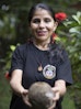 Woman holding a Brazil Nut