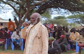 Community elder speaking at a land assembly in Koija, Laikipia.