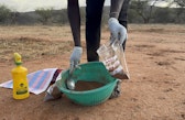 soilAfter the soil was collected, one of the research assistants from the community is putting it in a sample bag to be sent to the laboratory.