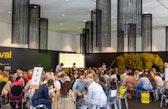 Diplomacy Day participants discuss international cooperation in small working groups around tables at PalaCinema.
