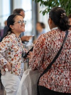 Three women talk together during a break at the 2026 SOR4D Conference in Bern.