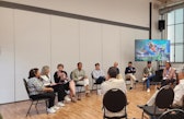Elisabeth Bürgi Bonanomi speaks into a microphone during a panel discussion at the 2026 SOR4D Conference.