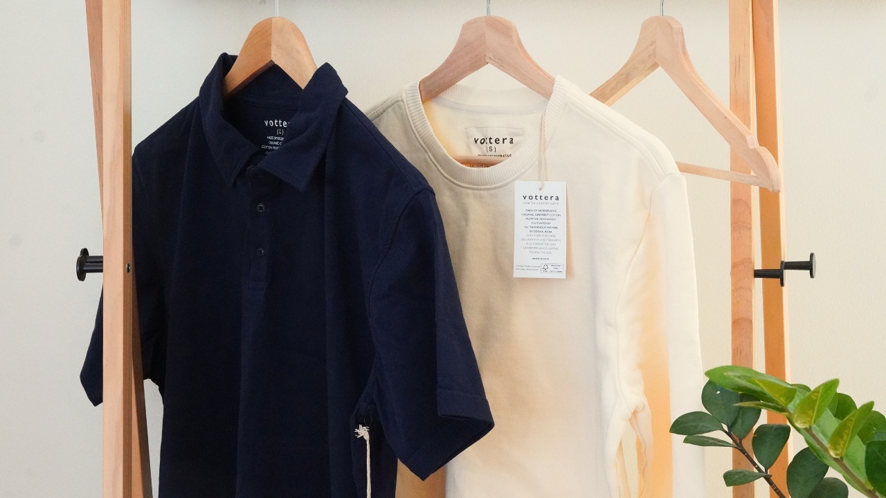 Vottera Clothes Hanging on a Clothes Rack With Plant