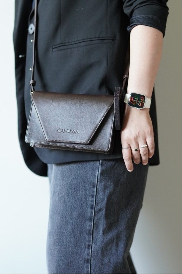 Woman in Black Blazer Wearing Canussa Bag