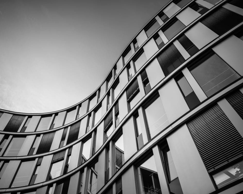 greyscale up view of building