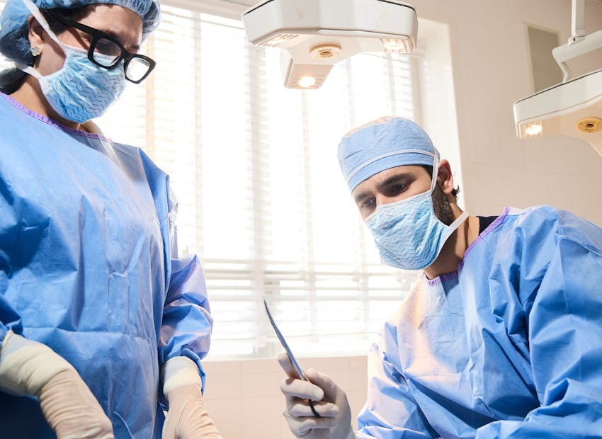 Dr. Alemi in surgical attire