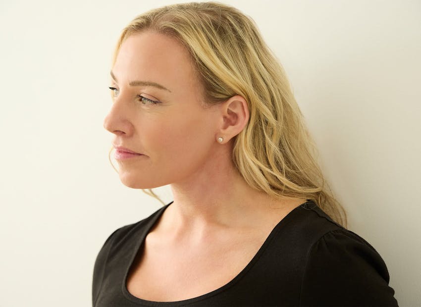 blonde woman looking to the left