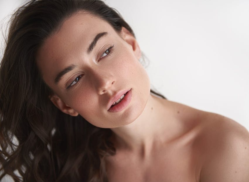 woman leaning head to the side