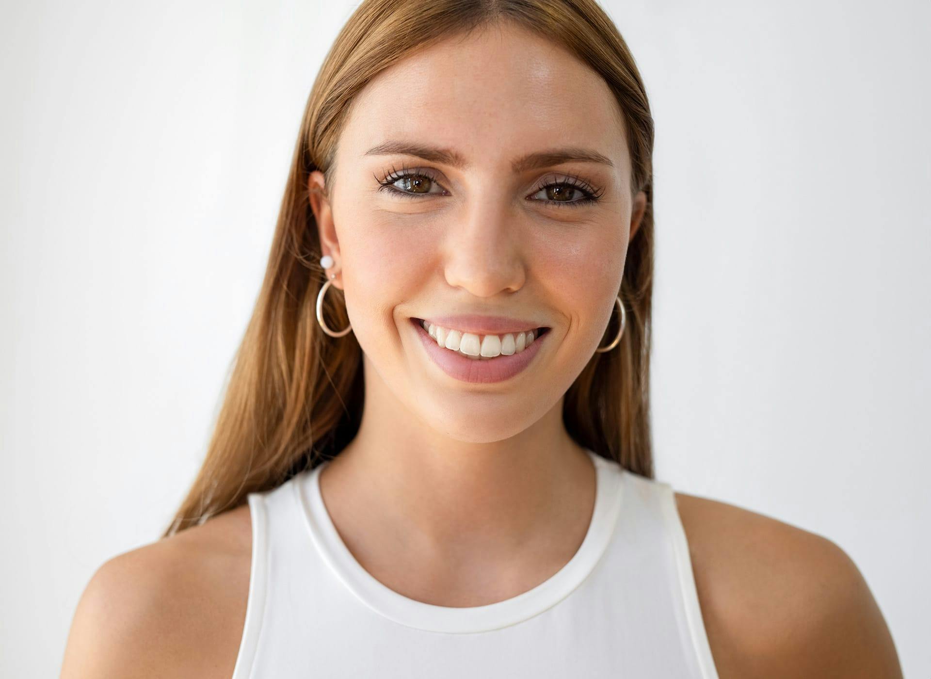 woman with red hair smiling forward