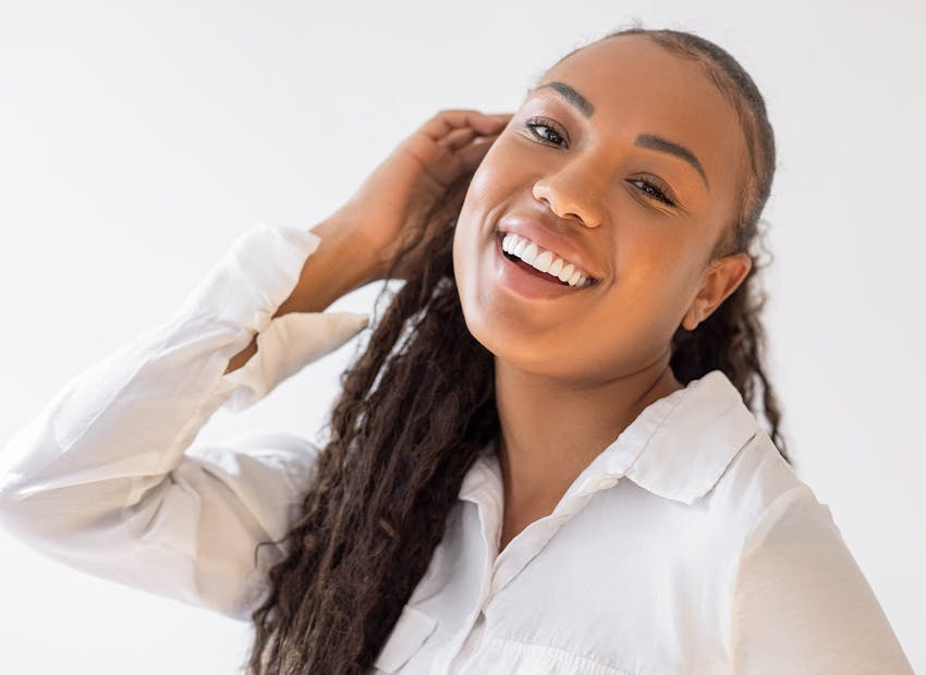 woman with dreads smiling