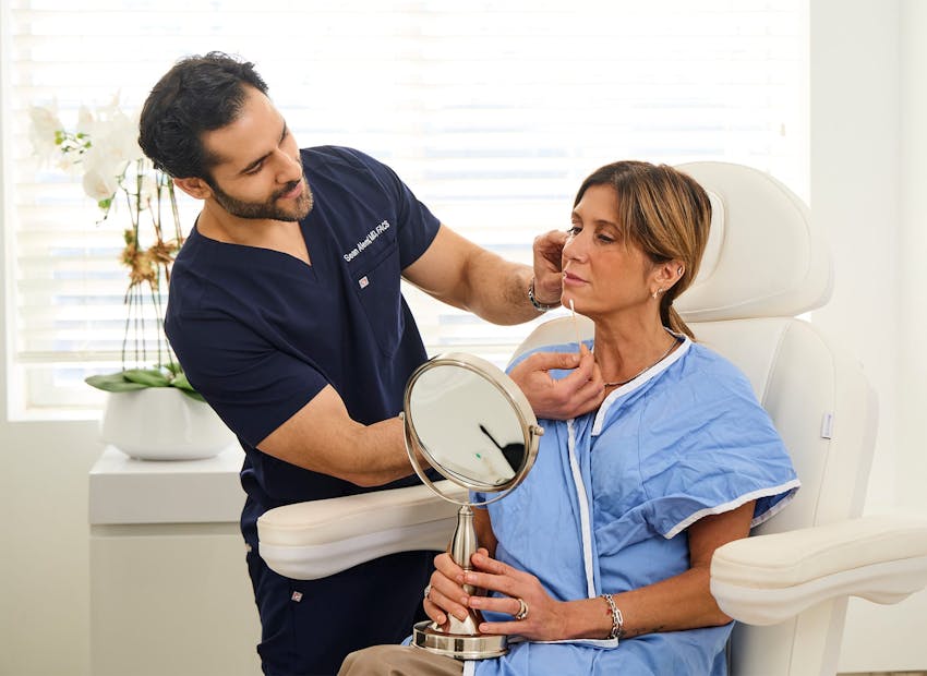 Dr. Alemi observing his client's face