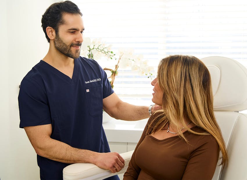 Dr. Alemi talking to client