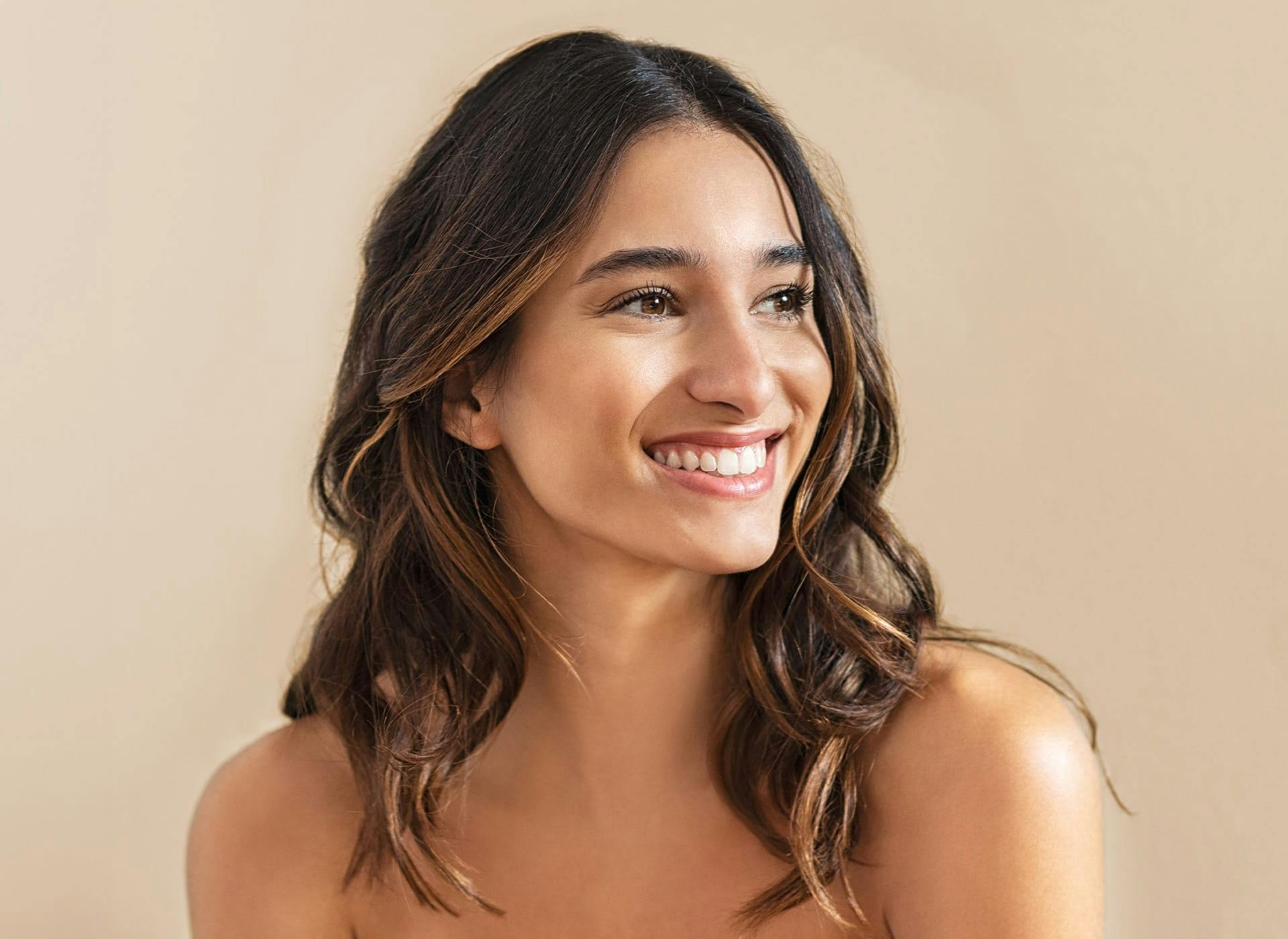 woman smiling and looking to the left