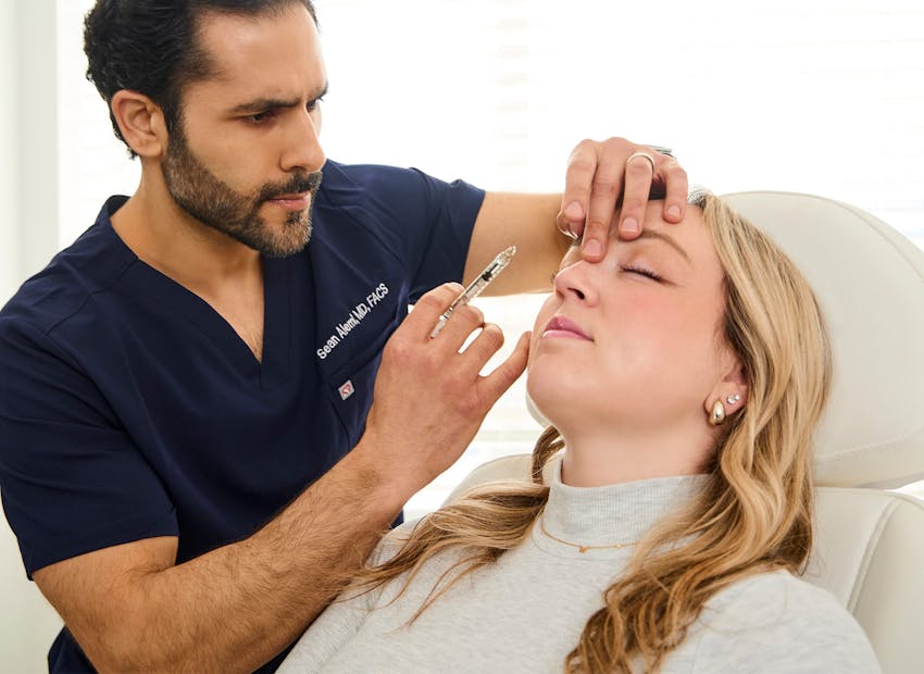 Dr. Alemi about to inject into client's nose