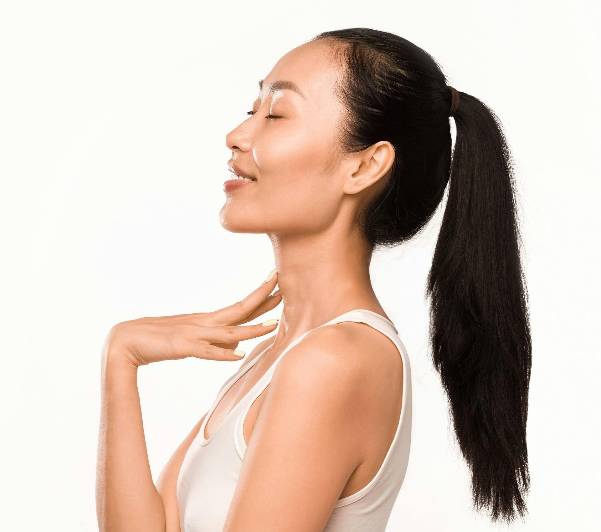 side angle of woman with high ponytail