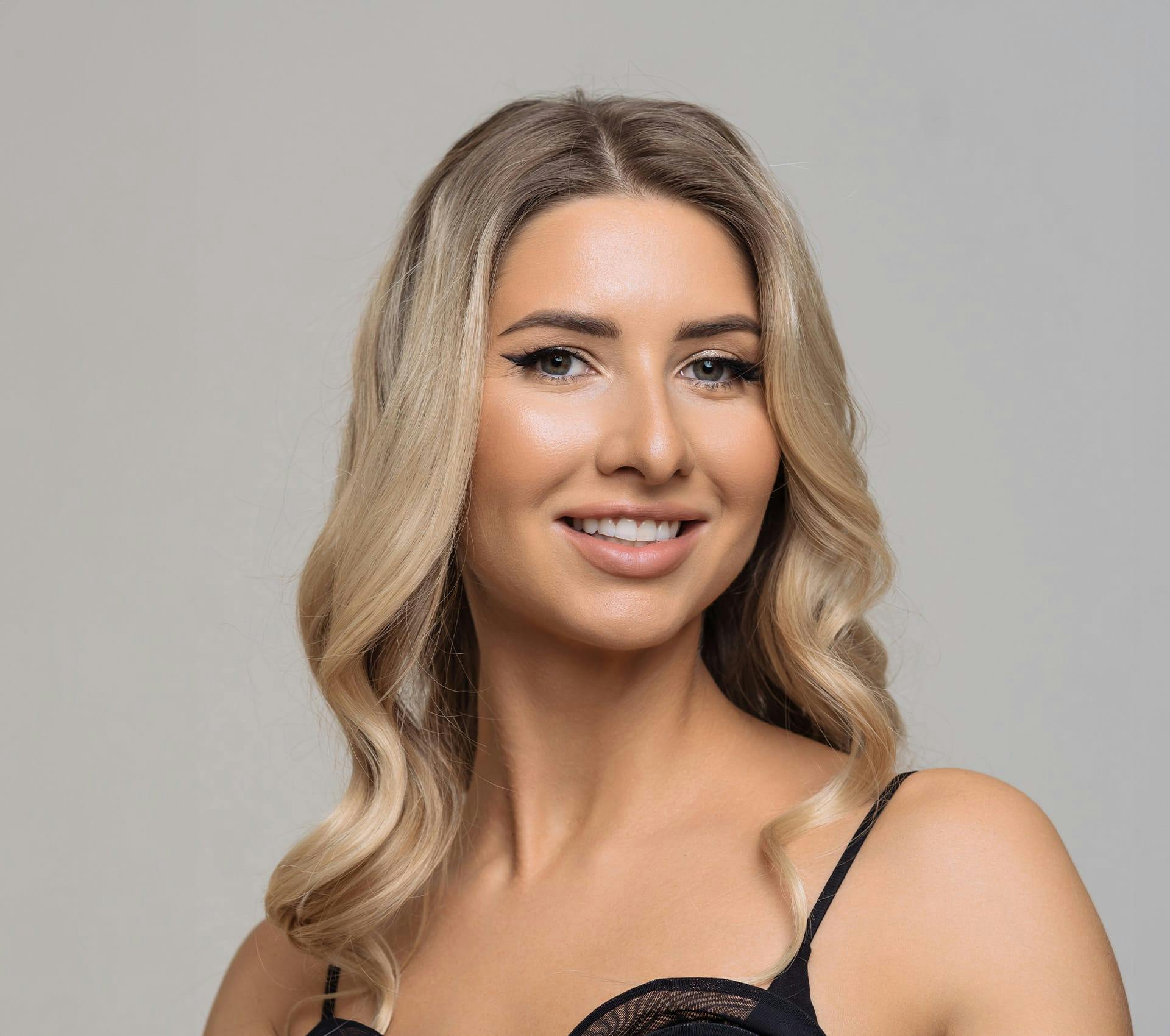 woman with blonde hair smiling