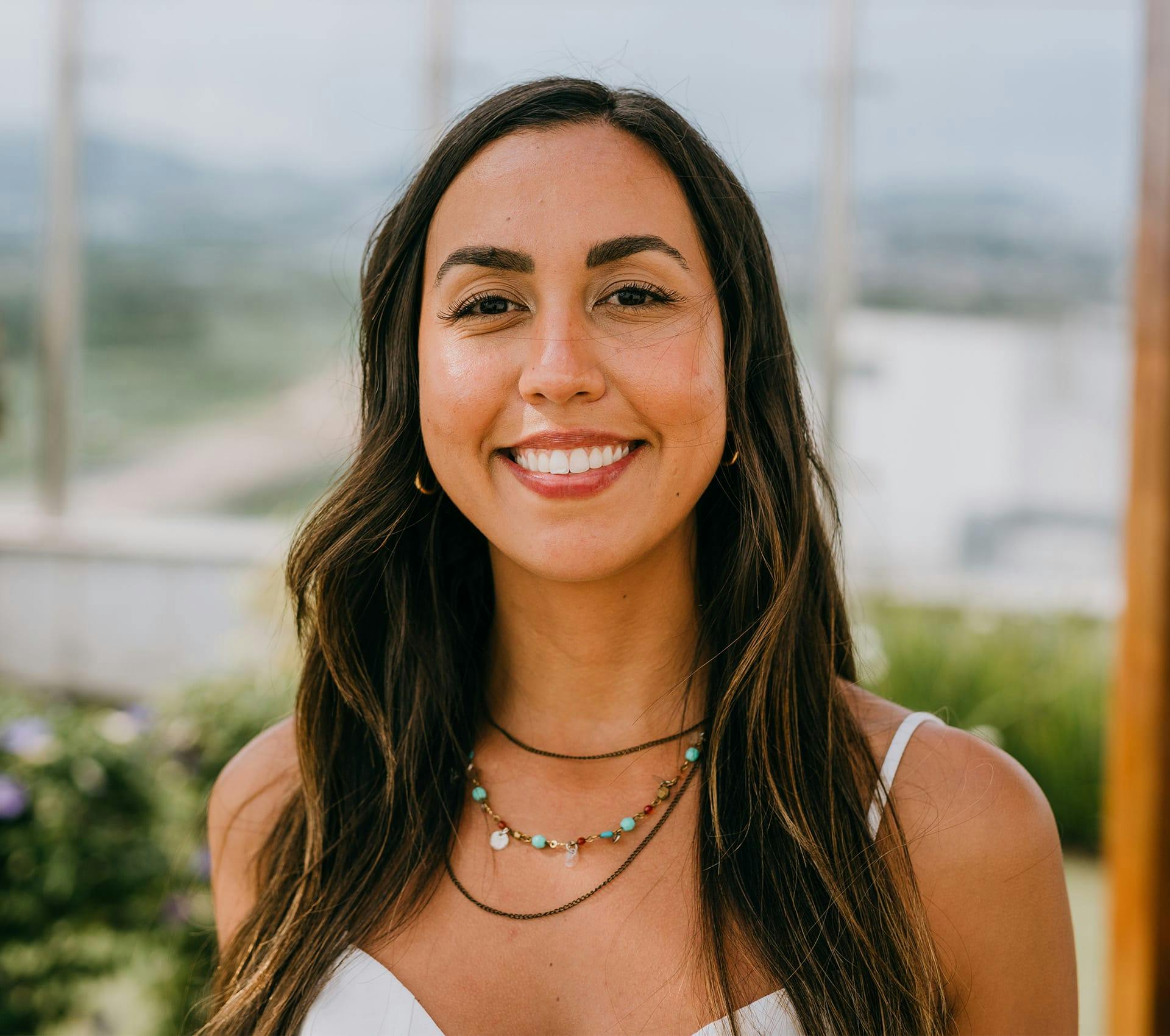 woman with long brown hair smiling