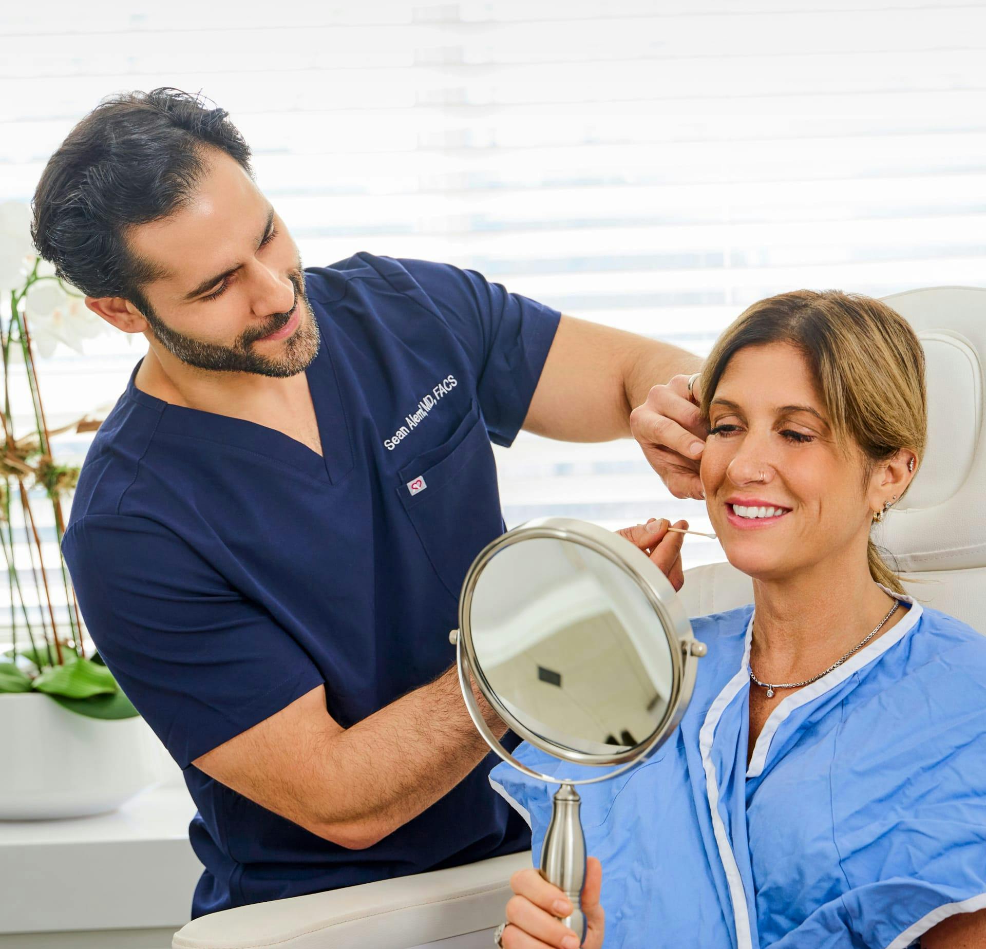 Dr. Alemi working with a patient