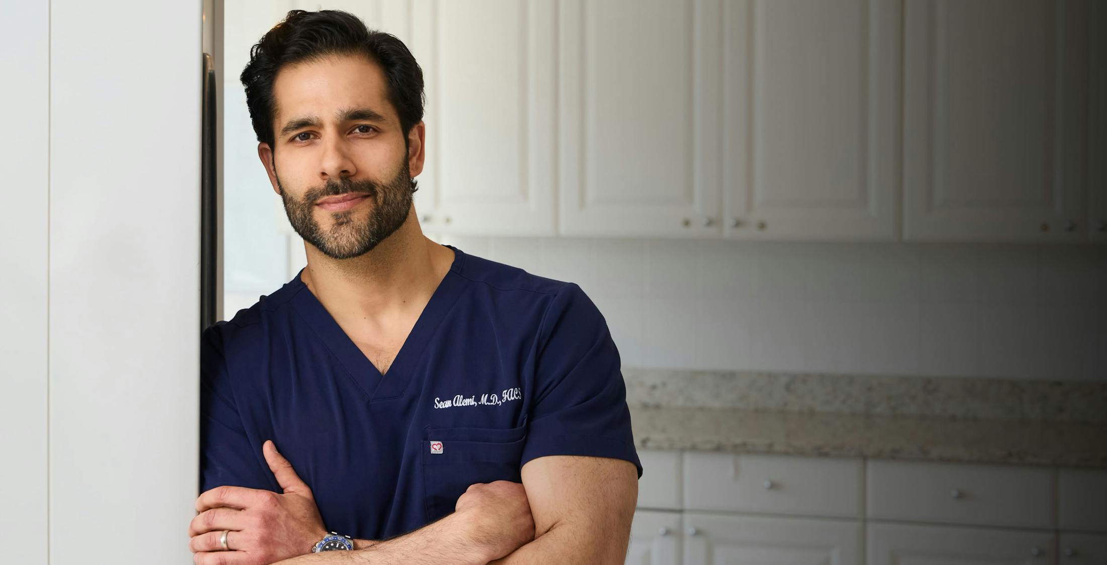 Dr, Sean Alemi leaning against a doorframe