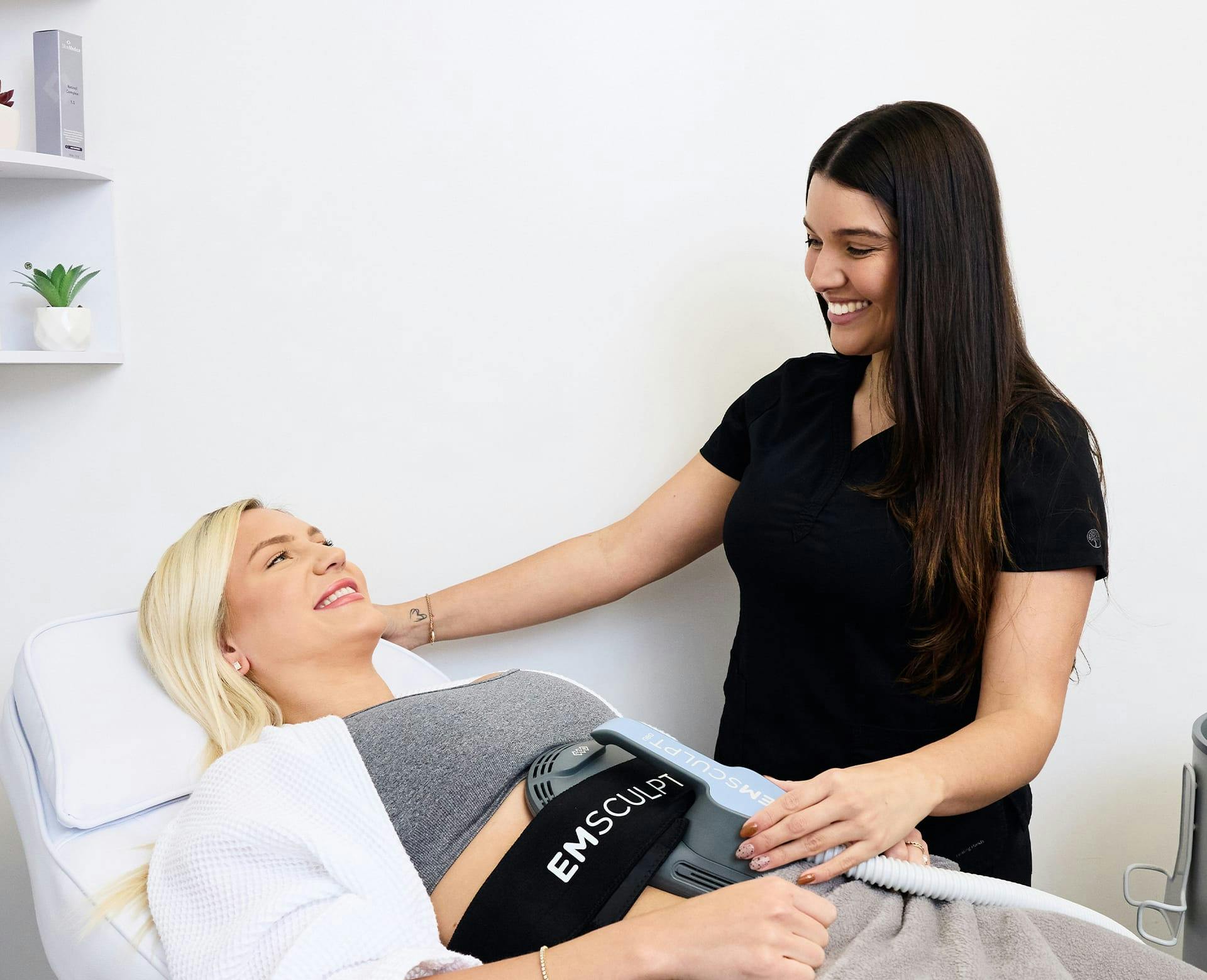woman getting emsculpt procedure