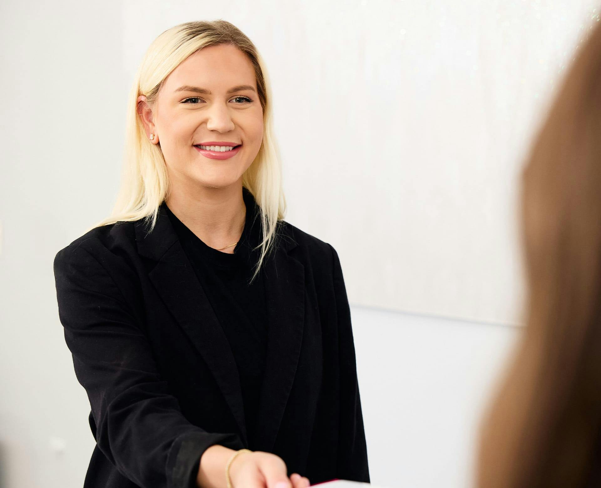woman with blonde hair smiling