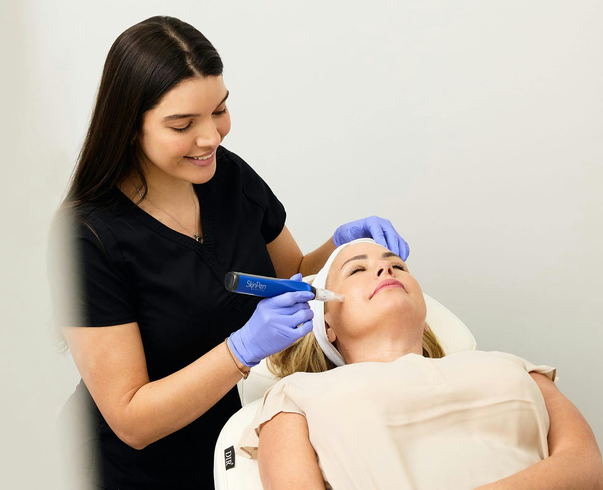 woman getting a SkinPen microneedling treatment