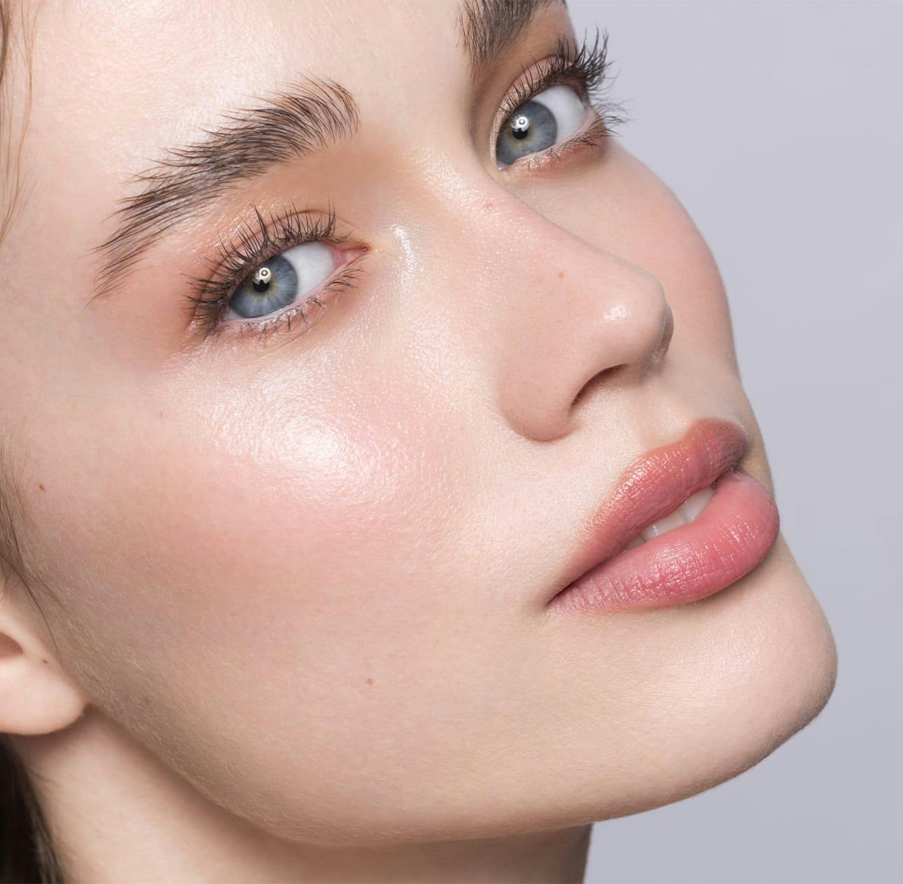 woman with clear skin and blue eyes