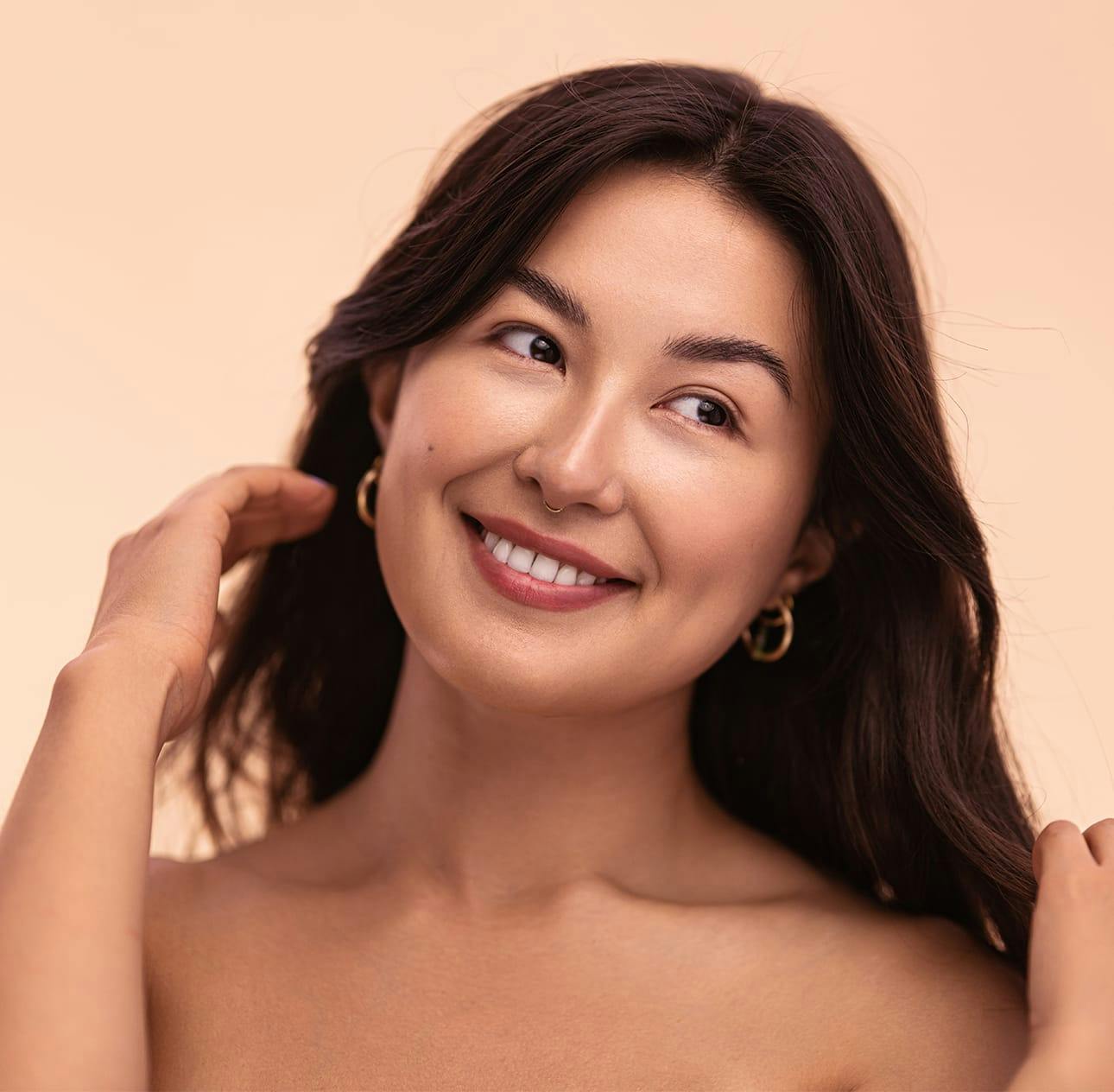 woman with long brown hair smiling