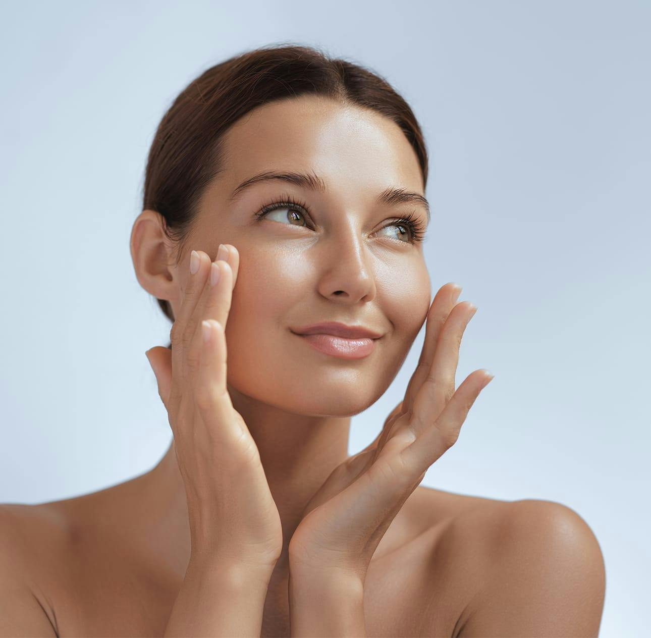 woman touching the sides of her face