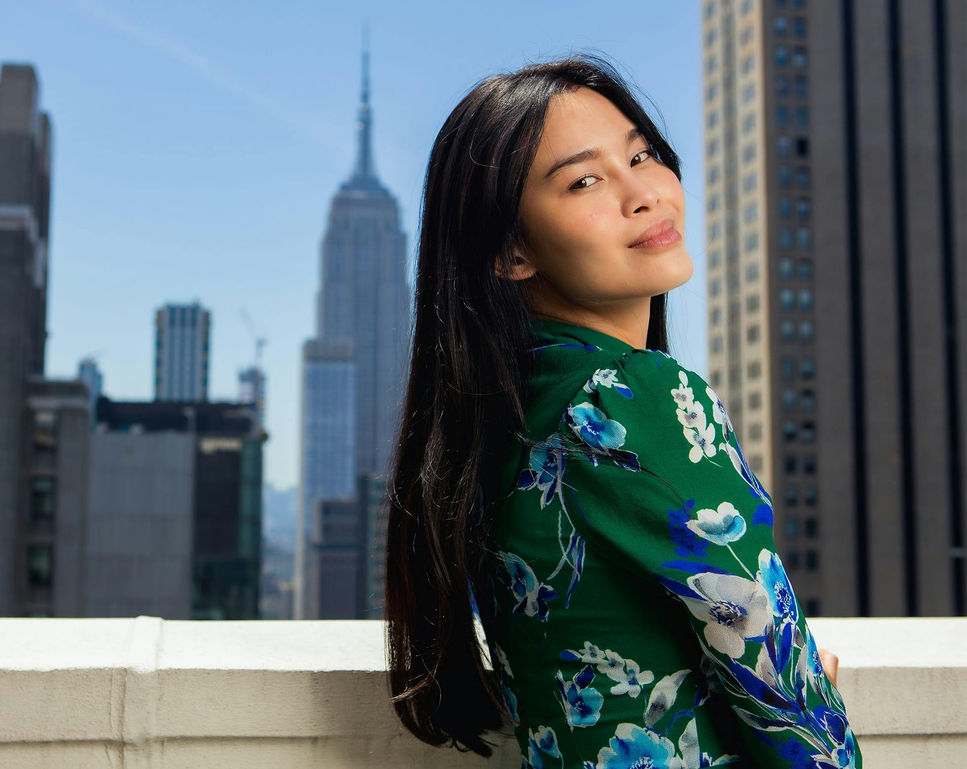 woman wearing a green floral top