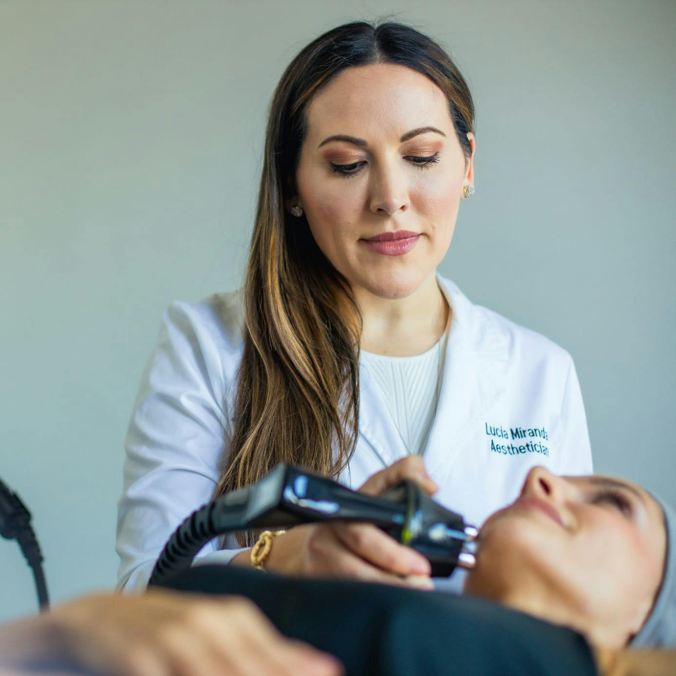 A patient getting her face lasered