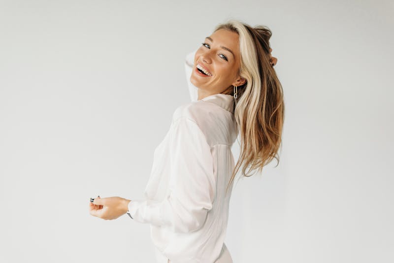 woman touching her hair