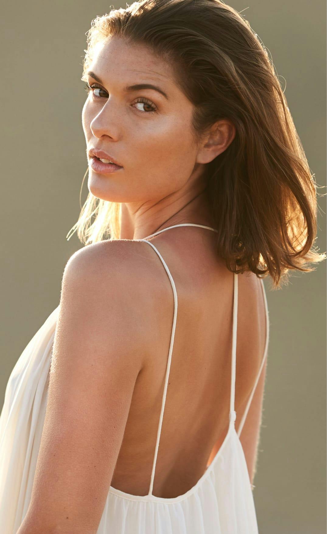 woman looking over her shoulder