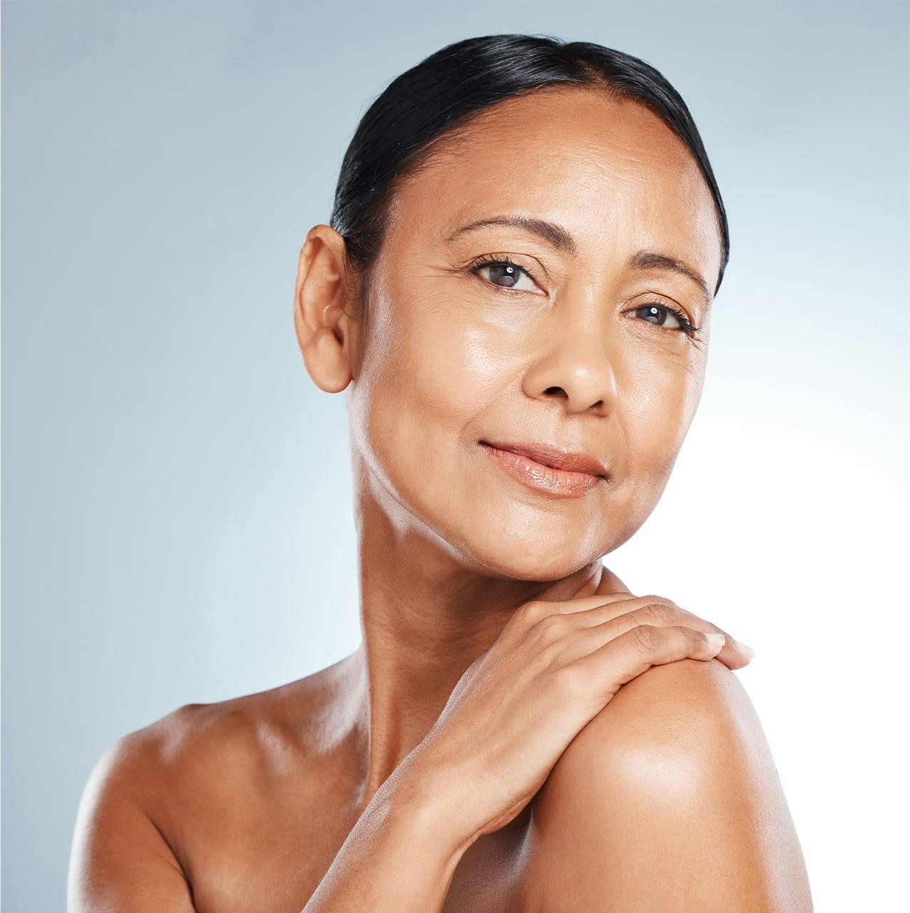 woman with hand on shoulder