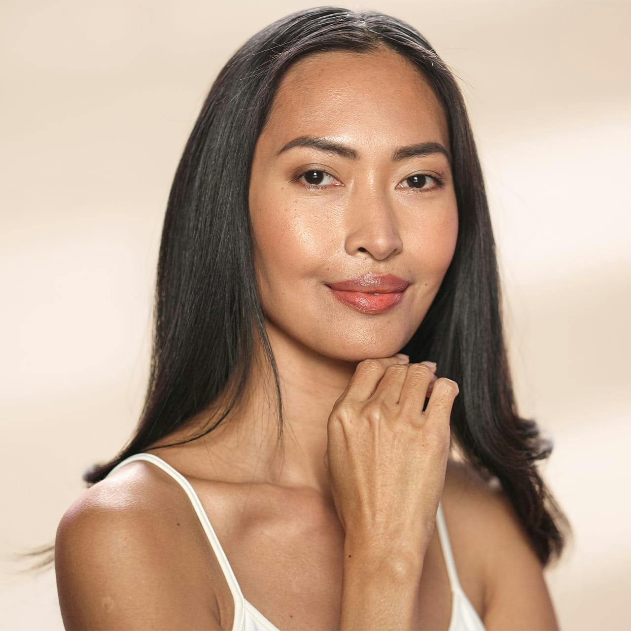woman with hand under chin