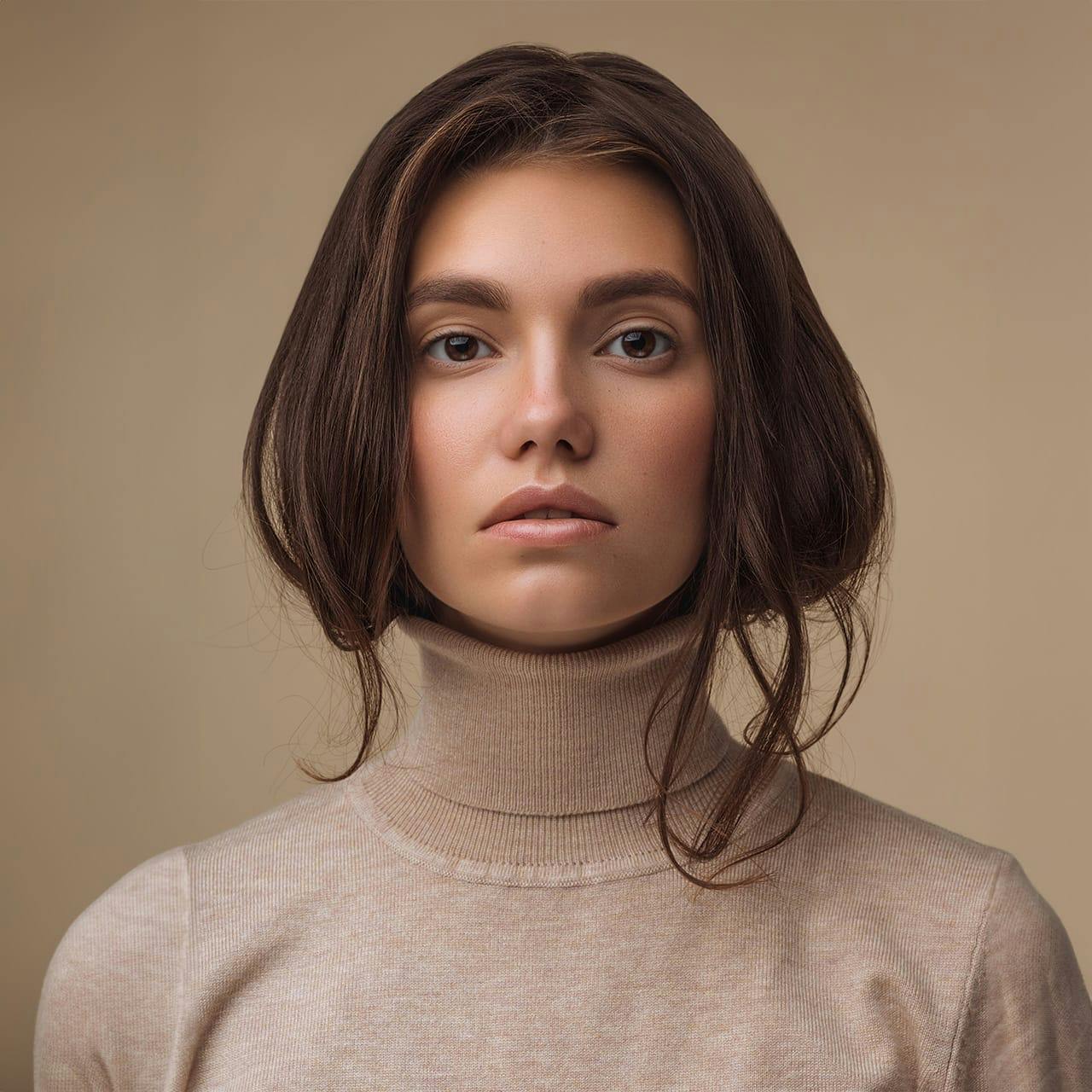 woman with hair inside her turtle neck