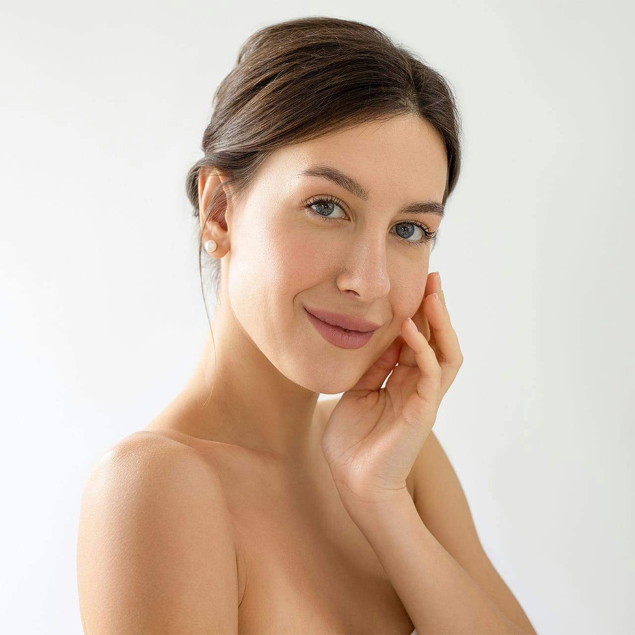 woman with hand on chin