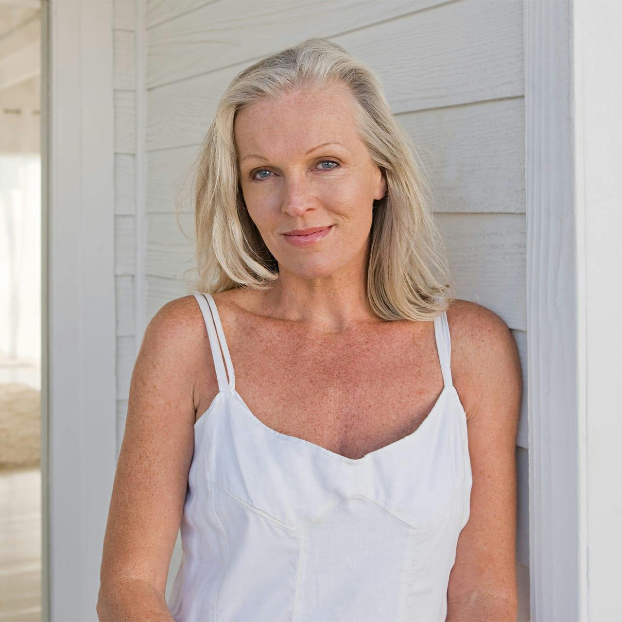 woman standing near front door