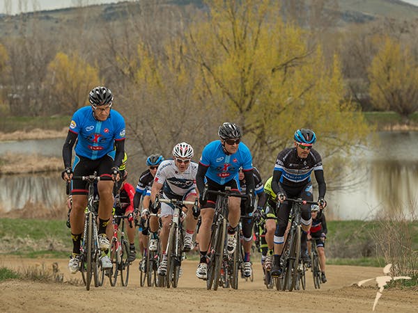 Dr. Slenkovich (in white) rides in the Buff Gold Circuit race in Boulder.