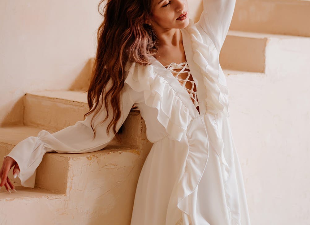 woman in a white frilly dress