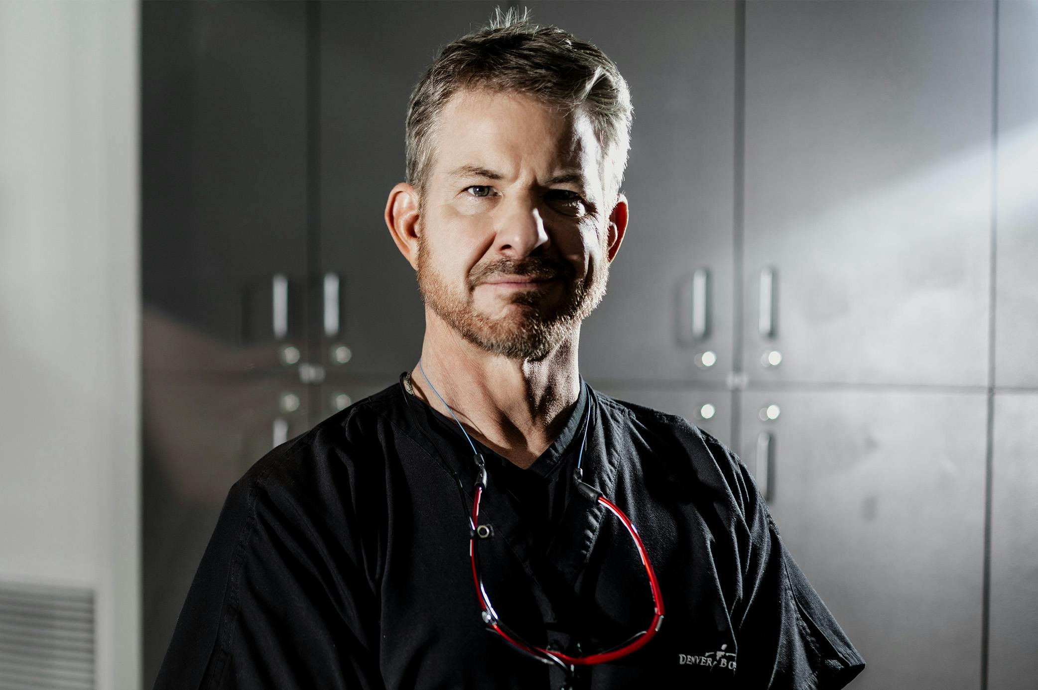 doctor standing with his arms crossed