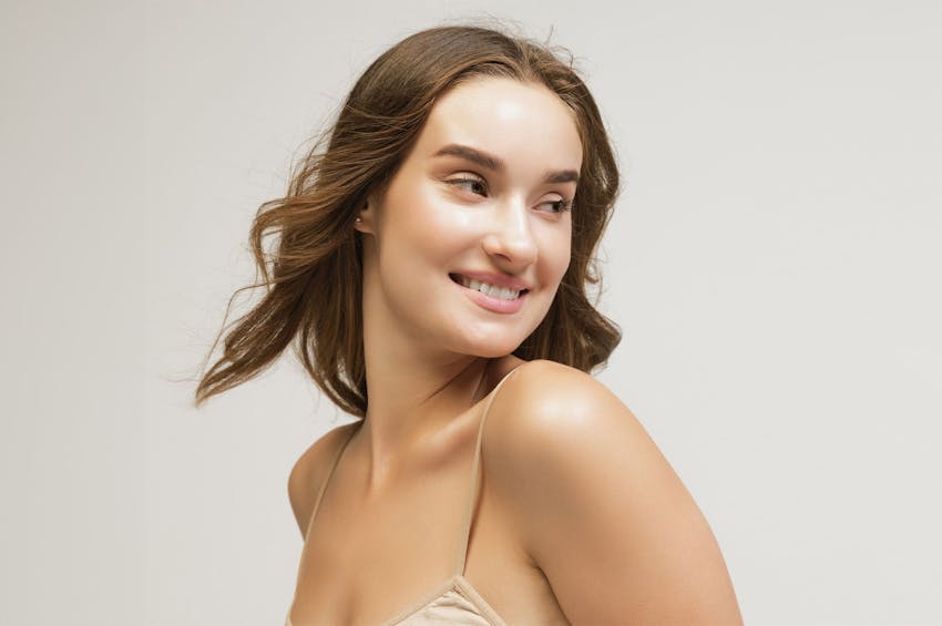 woman with head turned slightly downwards