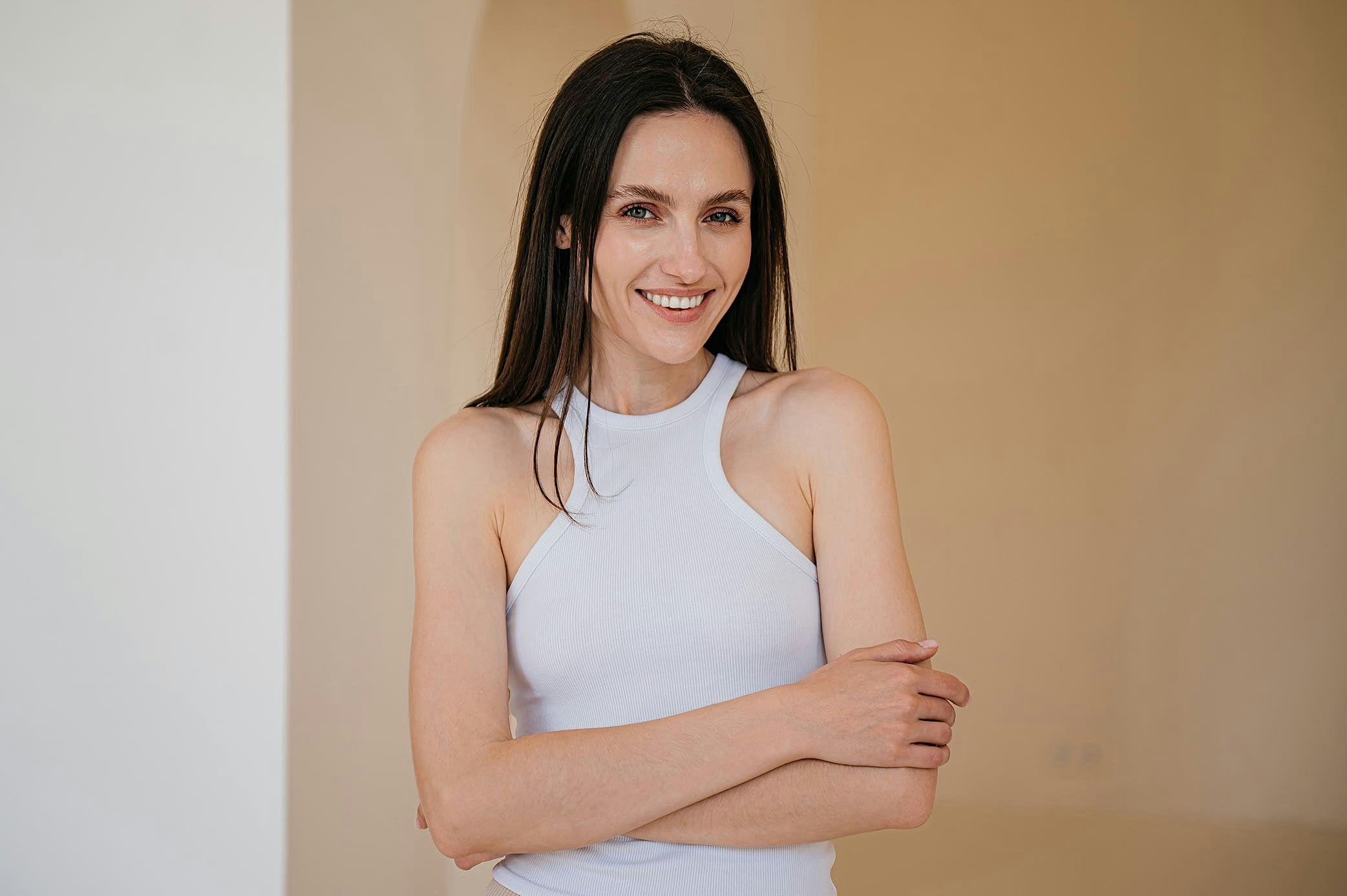 smiling woman with arms crossed