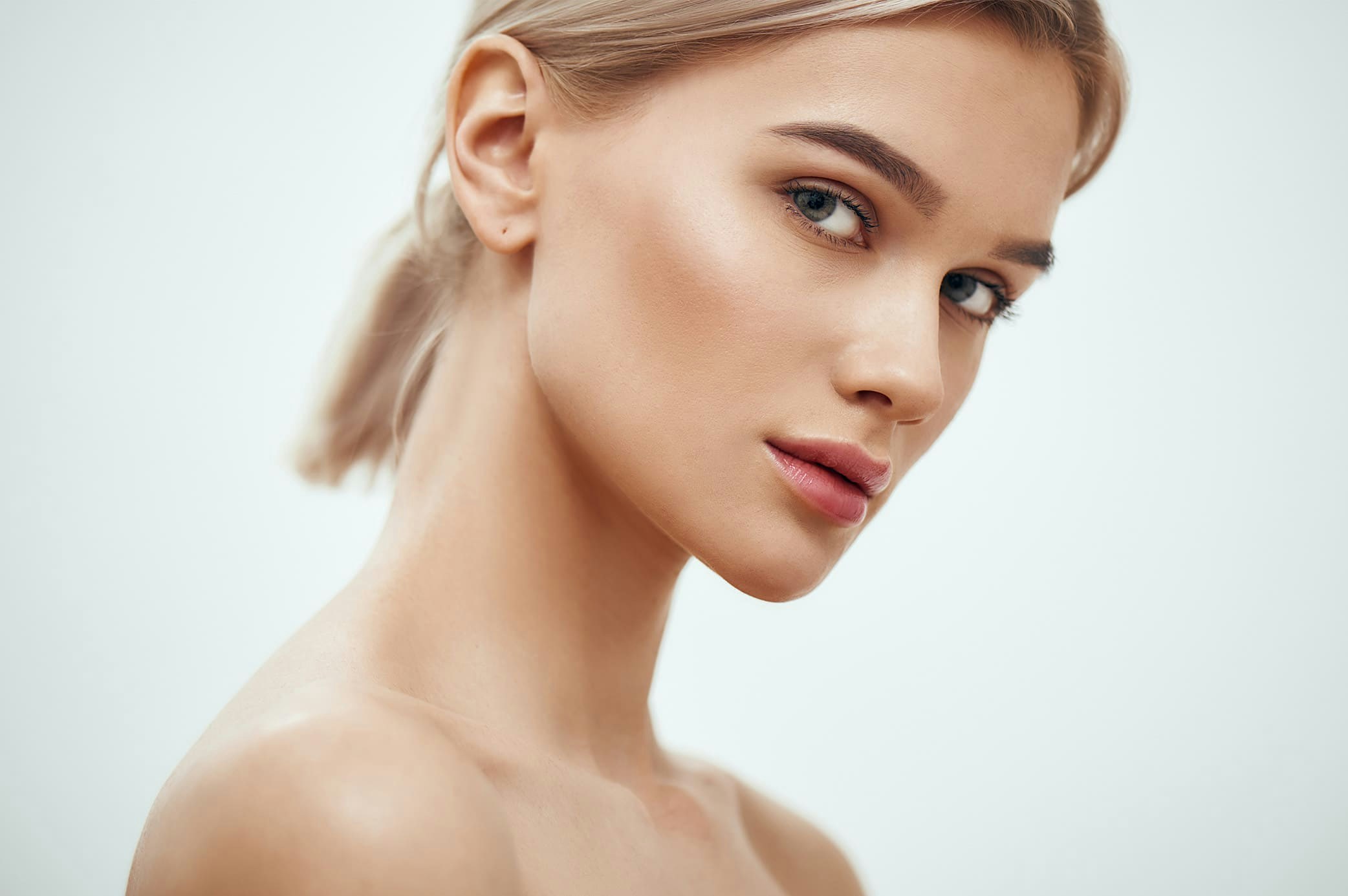 woman with head turned slightly downwards