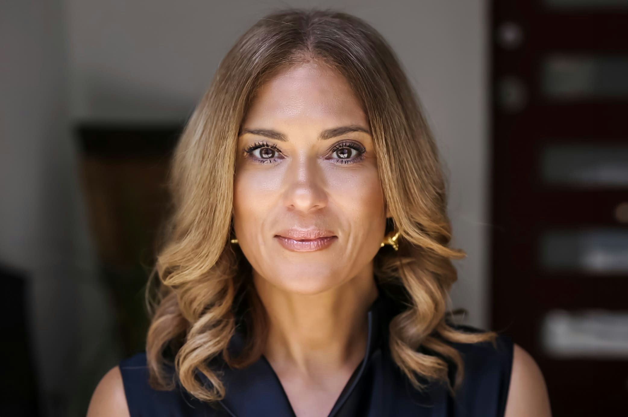 woman with curly light brown hair
