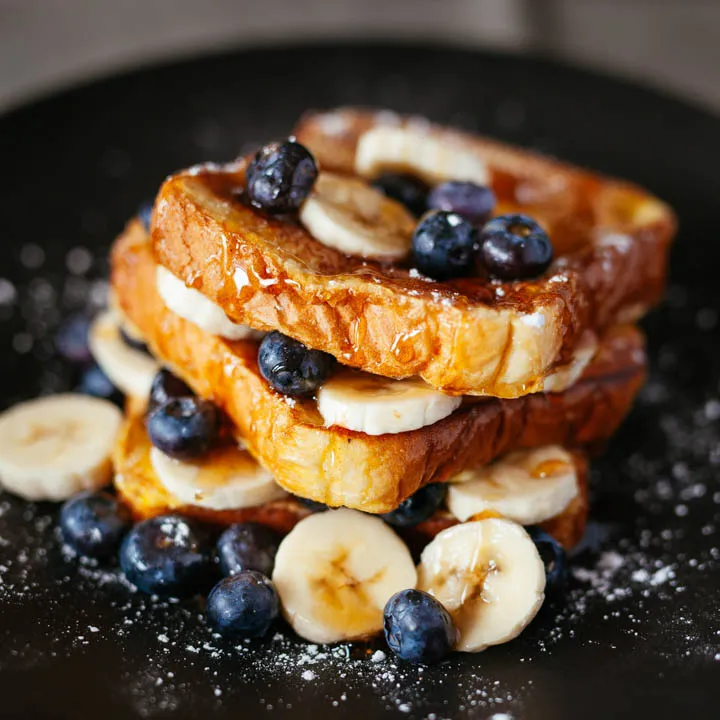 french toast with blue berries and bananas